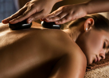 Massage with hot basalt stones
